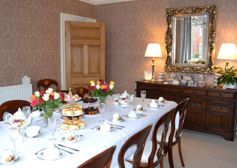 The dining room at Edengarth in Wigan boasts many classic and original features with the elegant marble fireplace 
